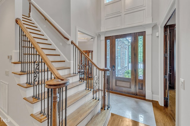 104 Bellagio Dr, Apex, NC 27539 - entryway featuring stairway, baseboards, and light wood finished floors
