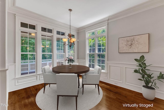 104 Bellagio Dr, Apex, NC 27539 - dining room with a chandelier, a decorative wall, ornamental molding, wainscoting, and dark wood-style flooring