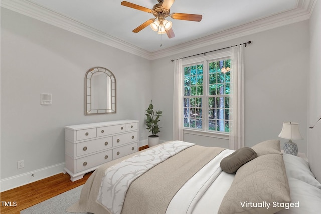 104 Bellagio Dr, Apex, NC 27539 - bedroom with wood finished floors, baseboards, crown molding, and ceiling fan