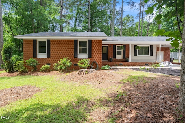 2968 Tram Rd, Fuquay Varina, NC 27526 - single story home with crawl space, a front yard, a shingled roof, and brick siding