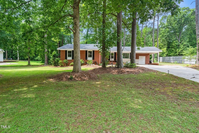 2968 Tram Rd, Fuquay Varina, NC 27526 - ranch-style house featuring concrete driveway, an attached carport, and brick siding