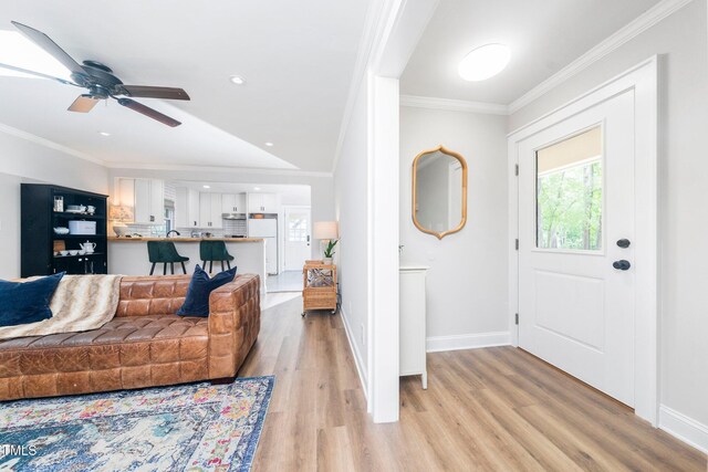 2968 Tram Rd, Fuquay Varina, NC 27526 - living room with light wood-style floors, crown molding, baseboards, a ceiling fan, and recessed lighting