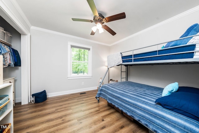 2968 Tram Rd, Fuquay Varina, NC 27526 - bedroom featuring wood finished floors, baseboards, ornamental molding, and a ceiling fan