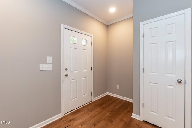 1006 Oxford Ridge Rd, Wake Forest, NC 27587 - entrance foyer featuring crown molding, dark wood-style floors, and baseboards