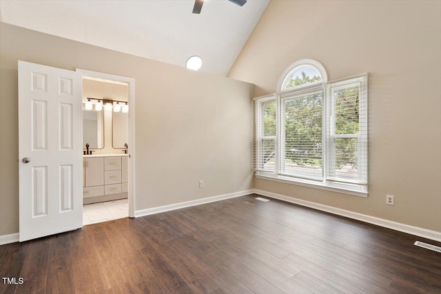 71 E Boxley Dr, Wendell, NC 27591 - spare room featuring ceiling fan, healthy amount of natural light, wood finished floors, high vaulted ceiling, and baseboards
