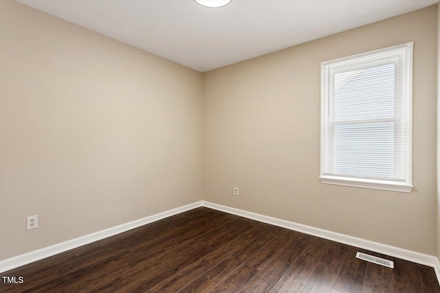 71 E Boxley Dr, Wendell, NC 27591 - spare room featuring baseboards and dark wood-style flooring