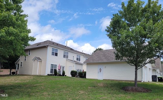 4202 Cherry Blossom Cir, Durham, NC 27713 - back of property featuring a lawn and roof with shingles