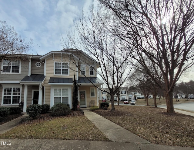 4202 Cherry Blossom Cir, Durham, NC 27713 - view of front of house with a standing seam roof and metal roof