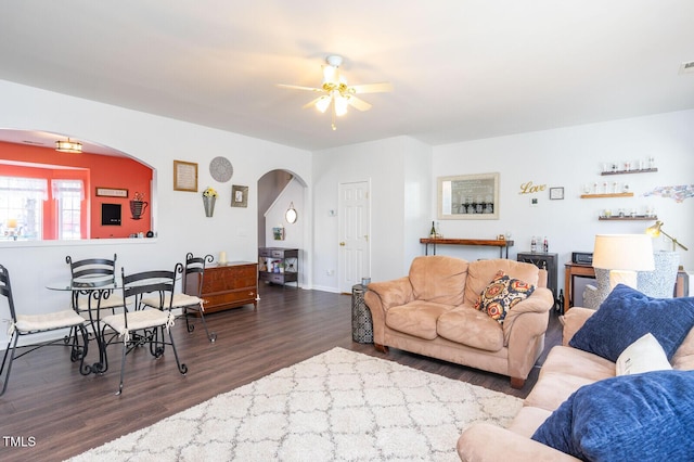 610 Walnut Woods Dr, Morrisville, NC 27560 - living area with arched walkways, wood finished floors, a ceiling fan, and baseboards