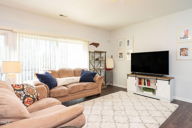 610 Walnut Woods Dr, Morrisville, NC 27560 - living room featuring dark wood finished floors and baseboards