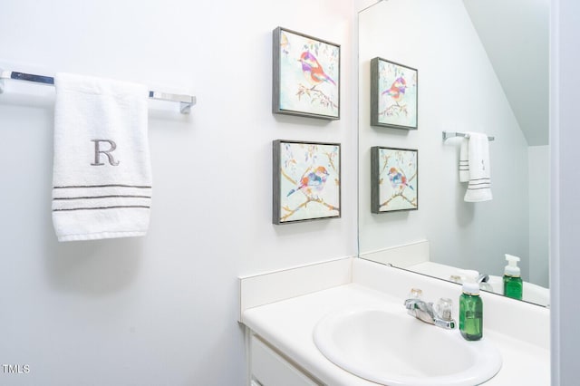 610 Walnut Woods Dr, Morrisville, NC 27560 - bathroom featuring vanity and vaulted ceiling