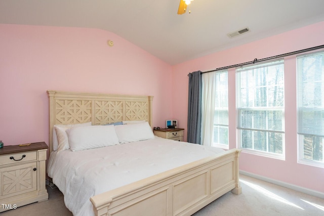 610 Walnut Woods Dr, Morrisville, NC 27560 - bedroom with vaulted ceiling, light colored carpet, multiple windows, ceiling fan, and baseboards
