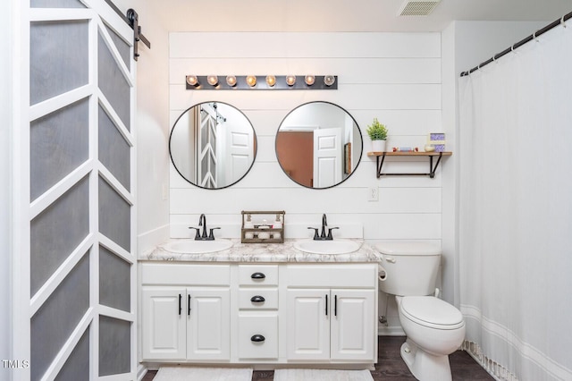 610 Walnut Woods Dr, Morrisville, NC 27560 - full bathroom with double vanity, toilet, and a shower with curtain