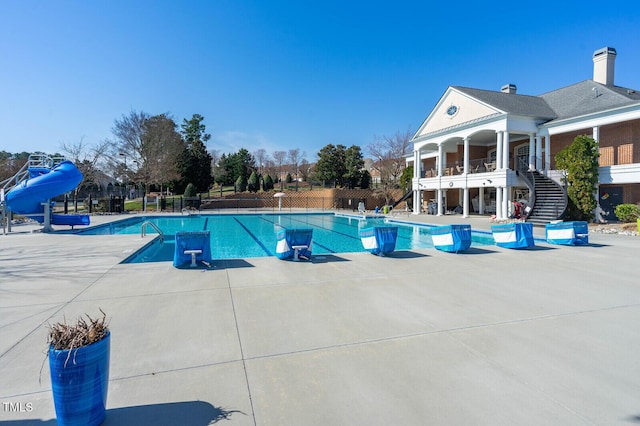 610 Walnut Woods Dr, Morrisville, NC 27560 - community pool with stairway, a water slide, and a patio