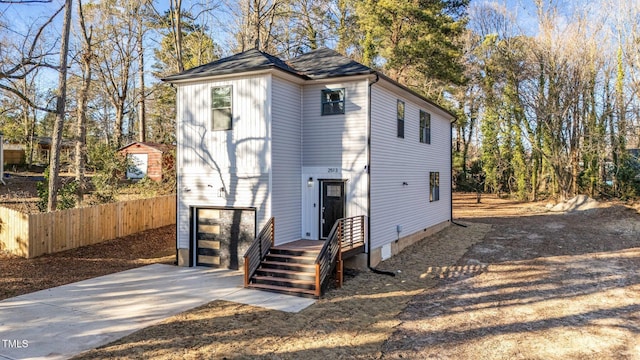 2513 Rochelle St, Durham, NC 27703 - view of outbuilding with concrete driveway and an attached garage