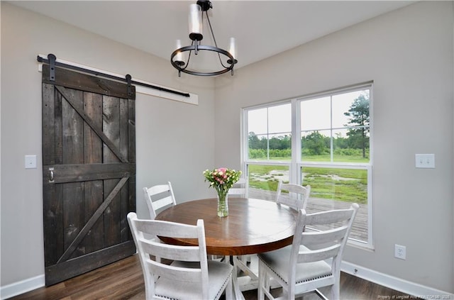 1865 John B Carter Rd, Fayetteville, NC 28312 - dining room with a chandelier, dark wood-type flooring, baseboards, and a barn door