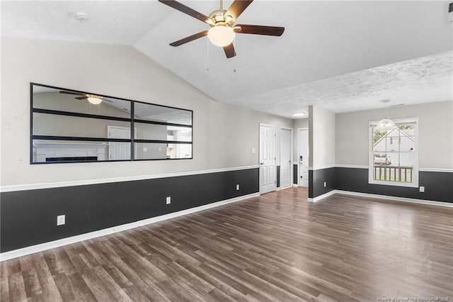 1419 Acacia Dr, Fayetteville, NC 28314 - empty room with ceiling fan, wood finished floors, vaulted ceiling, baseboards, and a smoke detector