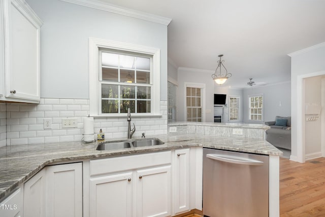 804 Town Side Dr, Apex, NC 27502 - kitchen with dishwasher, crown molding, backsplash, white cabinetry, and light stone counters