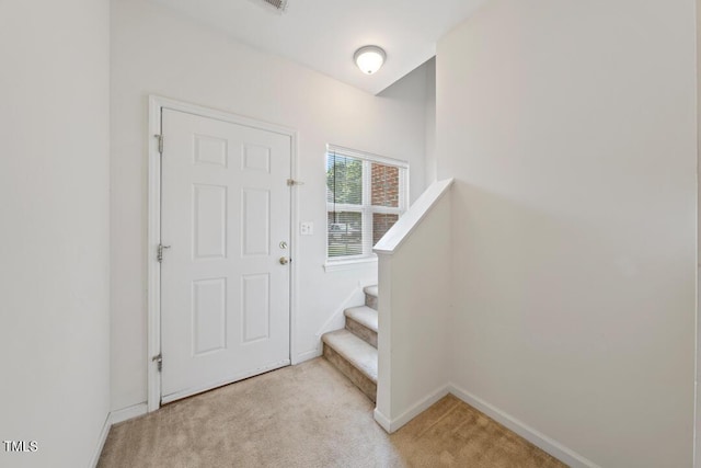 285 Plaza Dr Unit C, Chapel Hill, NC 27517 - entrance foyer with light carpet, baseboards, and stairway