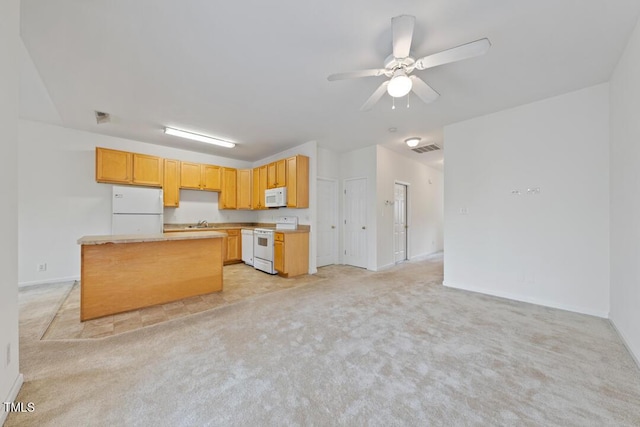 285 Plaza Dr Unit C, Chapel Hill, NC 27517 - kitchen featuring white appliances, light colored carpet, a center island, light countertops, and a ceiling fan