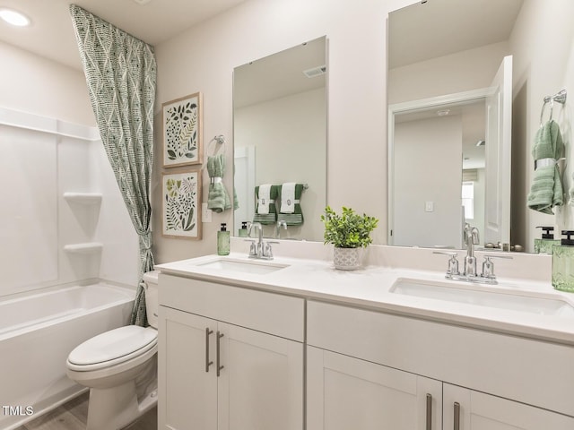 2254 Cherry Creek Rd, Haw River, NC 27258 - bathroom with double vanity, shower / bath combo with shower curtain, and wood finished floors