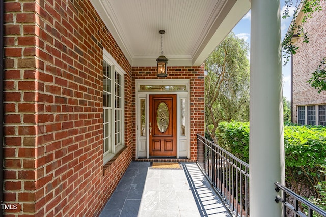 218 W Barbee Chapel Rd, Chapel Hill, NC 27517 - view of exterior entry featuring brick siding and a porch