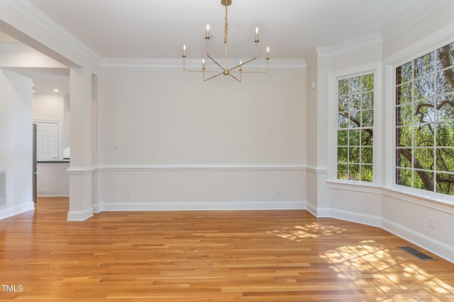 218 W Barbee Chapel Rd, Chapel Hill, NC 27517 - empty room featuring a chandelier, ornamental molding, light wood-type flooring, and baseboards