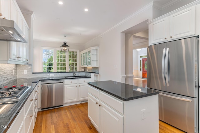 218 W Barbee Chapel Rd, Chapel Hill, NC 27517 - kitchen featuring stainless steel appliances, a sink, light wood-type flooring, decorative backsplash, and white cabinetry