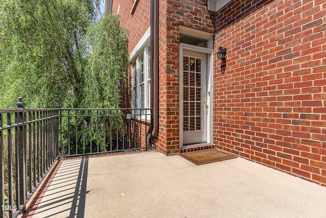 218 W Barbee Chapel Rd, Chapel Hill, NC 27517 - property entrance with brick siding and a balcony