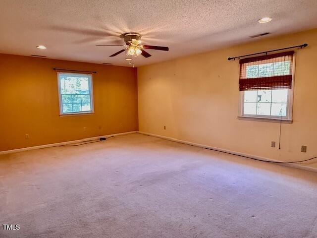 1007 Driftwood Dr, Siler City, NC 27344 - carpeted empty room with a textured ceiling, ceiling fan, and recessed lighting