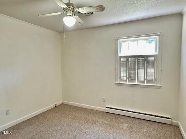 1007 Driftwood Dr, Siler City, NC 27344 - carpeted empty room with a baseboard heating unit and ceiling fan