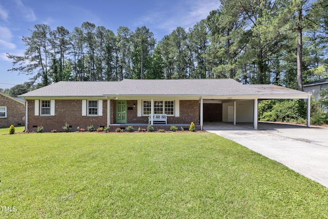 3009 Wellington Dr, Rocky Mount, NC 27803 - single story home featuring a carport, a front lawn, driveway, and brick siding
