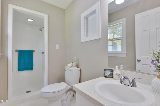 3009 Wellington Dr, Rocky Mount, NC 27803 - bathroom featuring toilet, tiled shower, and vanity