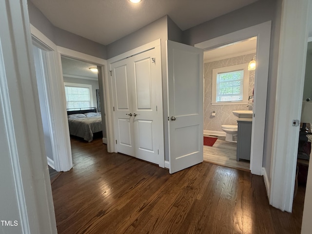 306 W Canary St, Dunn, NC 28334 - hallway with dark wood-style flooring and baseboards