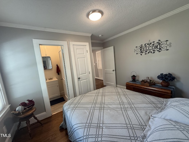 306 W Canary St, Dunn, NC 28334 - bedroom featuring crown molding, dark wood-type flooring, a textured ceiling, baseboards, and ensuite bathroom