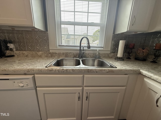 306 W Canary St, Dunn, NC 28334 - kitchen with dishwasher, a sink, white cabinets, light countertops, and backsplash