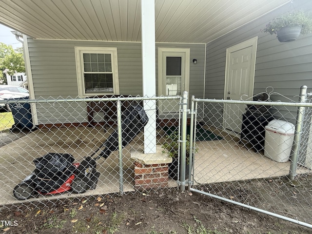 306 W Canary St, Dunn, NC 28334 - property entrance with a gate and covered porch