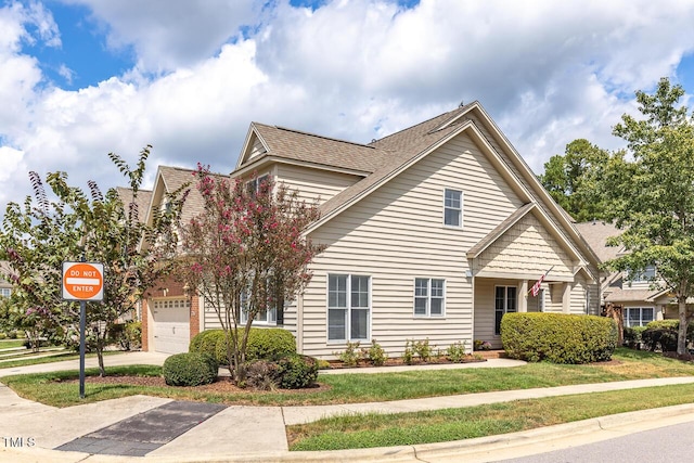 215 Dungarven Loop, Cary, NC 27513 - view of front facade featuring roof with shingles and a front lawn
