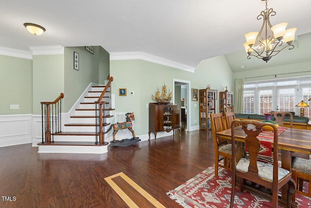 215 Dungarven Loop, Cary, NC 27513 - dining room featuring stairs, wood finished floors, a chandelier, ornamental molding, and lofted ceiling