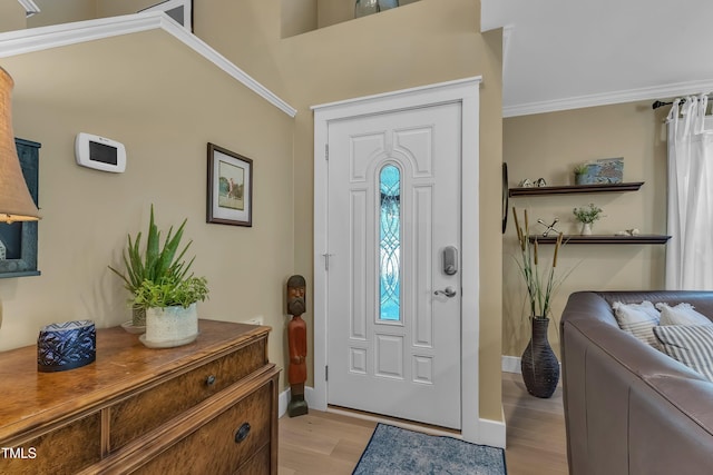 115 E Seve Ct, Morrisville, NC 27560 - foyer entrance with light wood-style flooring, baseboards, and crown molding
