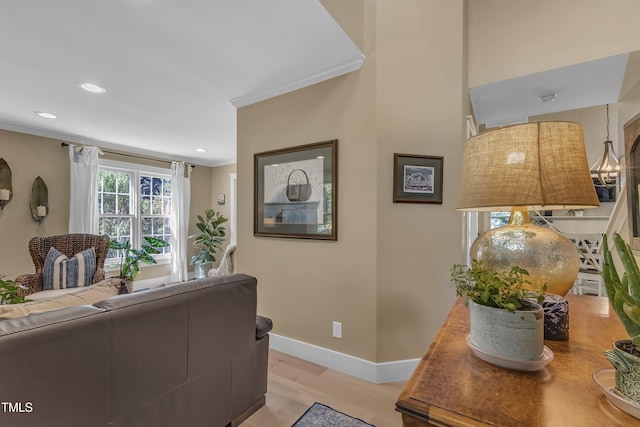 115 E Seve Ct, Morrisville, NC 27560 - living area featuring crown molding, light wood finished floors, baseboards, and recessed lighting