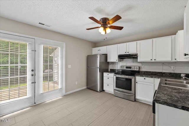 2228 Walnut Ridge Ct, Raleigh, NC 27610 - kitchen featuring appliances with stainless steel finishes, a sink, under cabinet range hood, ceiling fan, and dark countertops