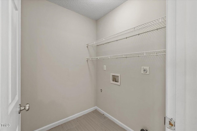 2228 Walnut Ridge Ct, Raleigh, NC 27610 - laundry room featuring washer hookup, electric dryer hookup, baseboards, and hookup for a gas dryer
