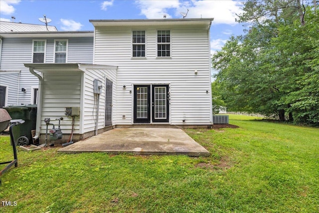 2228 Walnut Ridge Ct, Raleigh, NC 27610 - back of property featuring a patio area, a lawn, and central AC