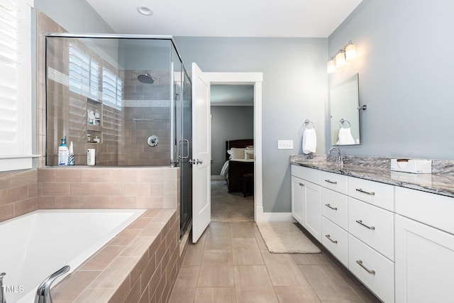 105 Everam Ct, Chapel Hill, NC 27516 - ensuite bathroom featuring a stall shower, a garden tub, vanity, and baseboards