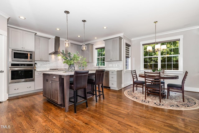 105 Everam Ct, Chapel Hill, NC 27516 - kitchen featuring appliances with stainless steel finishes, wall chimney exhaust hood, gray cabinetry, tasteful backsplash, and dark wood finished floors