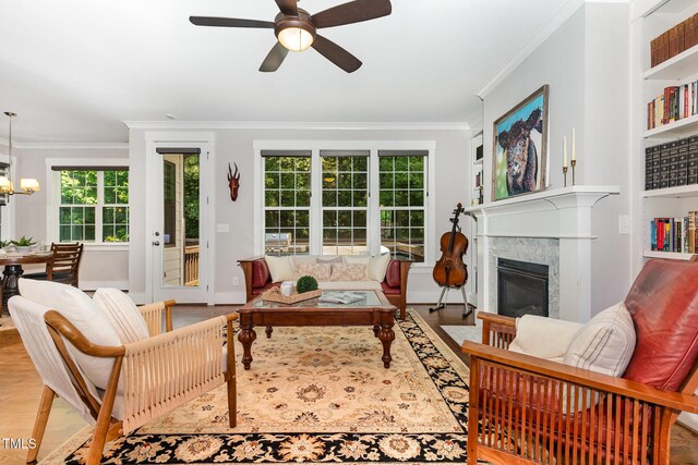 105 Everam Ct, Chapel Hill, NC 27516 - living area with ornamental molding, healthy amount of natural light, ceiling fan, a high end fireplace, and wood finished floors