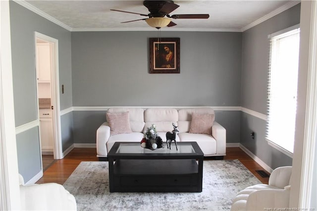 1955 Fairforest Dr, Fayetteville, NC 28304 - sitting room with healthy amount of natural light, a ceiling fan, wood finished floors, and ornamental molding