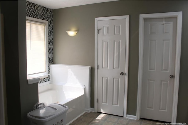 1955 Fairforest Dr, Fayetteville, NC 28304 - full bathroom with healthy amount of natural light, a bath, and baseboards