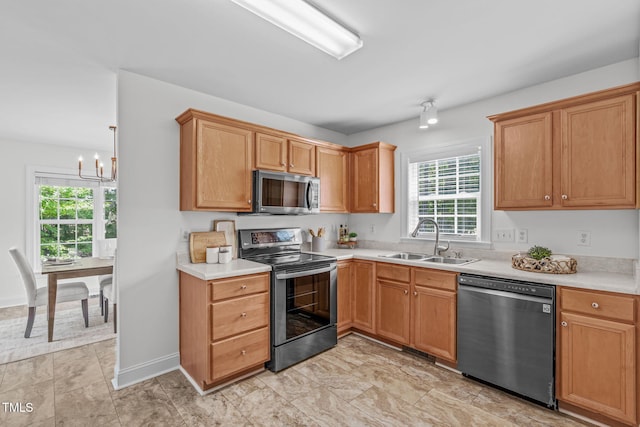 2575 Primrose Ln, Creedmoor, NC 27522 - kitchen with appliances with stainless steel finishes, a chandelier, and light countertops